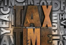 Guidance on tax-free corporate reorganization amended A photo of Tax Time in art