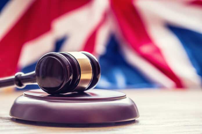 Judges wooden gavel with UK flag in the background. TLT partner Paul Gair Nick Curling Claire KershawJack Harg Punjab National Bank (PNB) CMS Cameron McKenna Nabarro Olswang